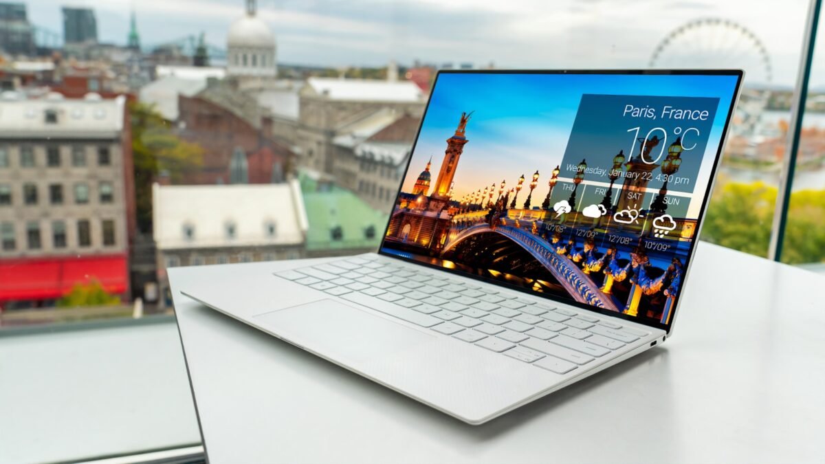 A modern laptop on a plain background